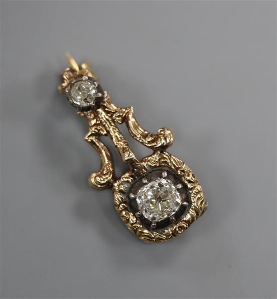 A 19th century yellow metal, old cushion and old round cut diamond set brooch (adapted?), 23mm.